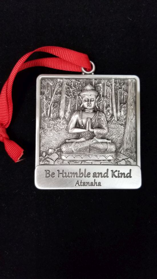 Be humble and kind medal with Buddha model in it