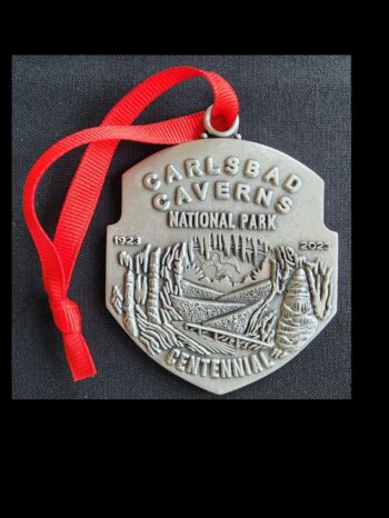 Carlsbad Caverns medal with a design printed in it