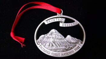 A silver ornament of Petrified Forest National Park.