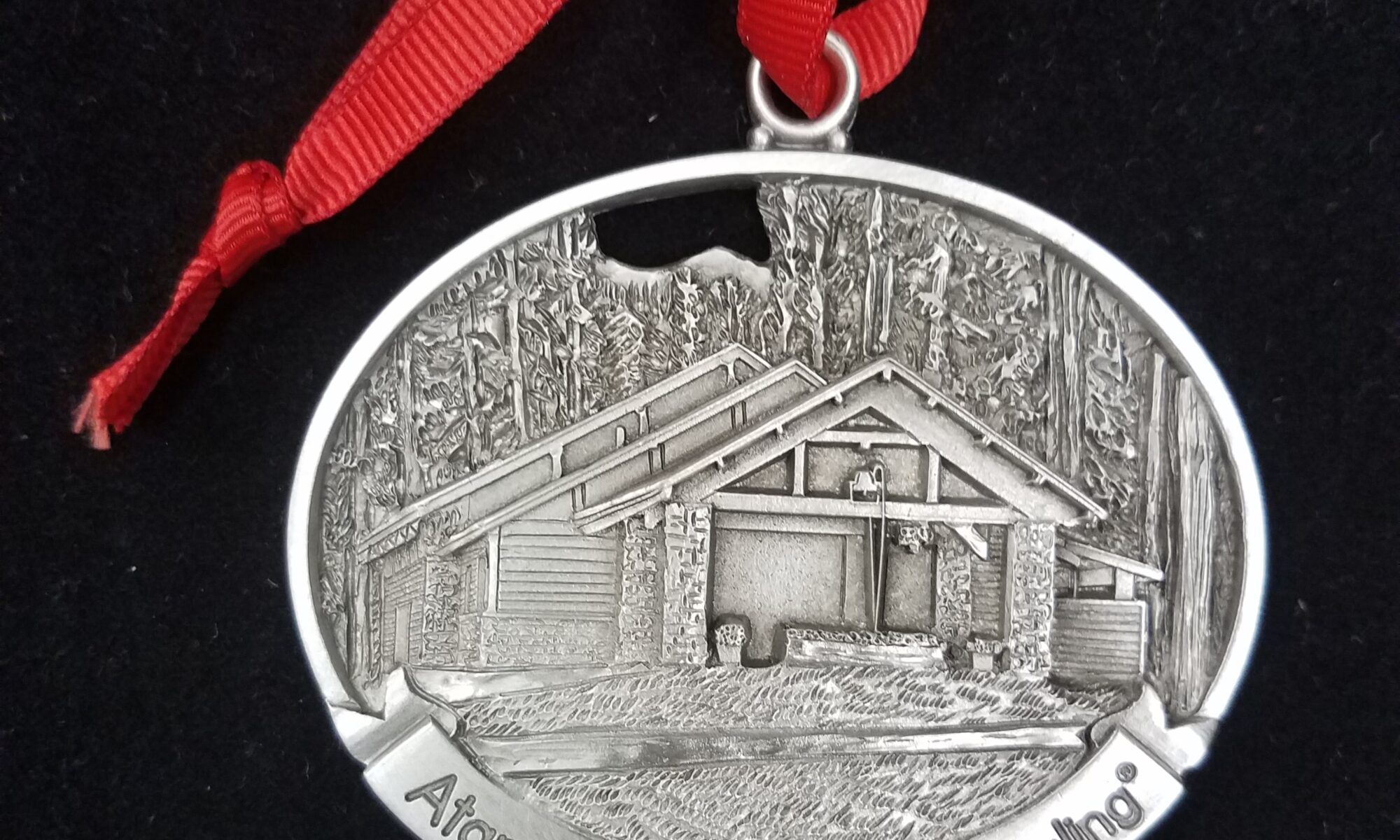 Atanaha home medal with mountain model