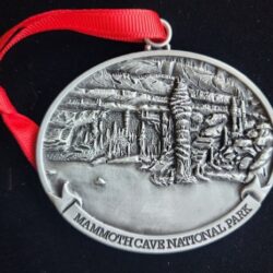 A silver ornament with the words mammoth cave national park on it.